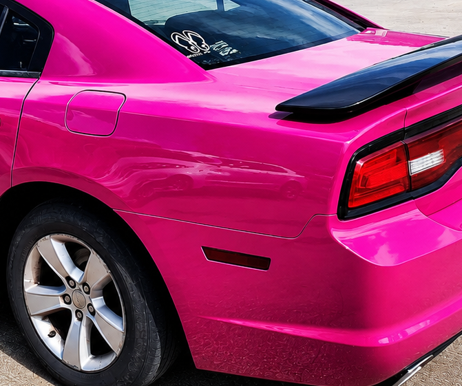 Pink Dodge Charger outside Peach